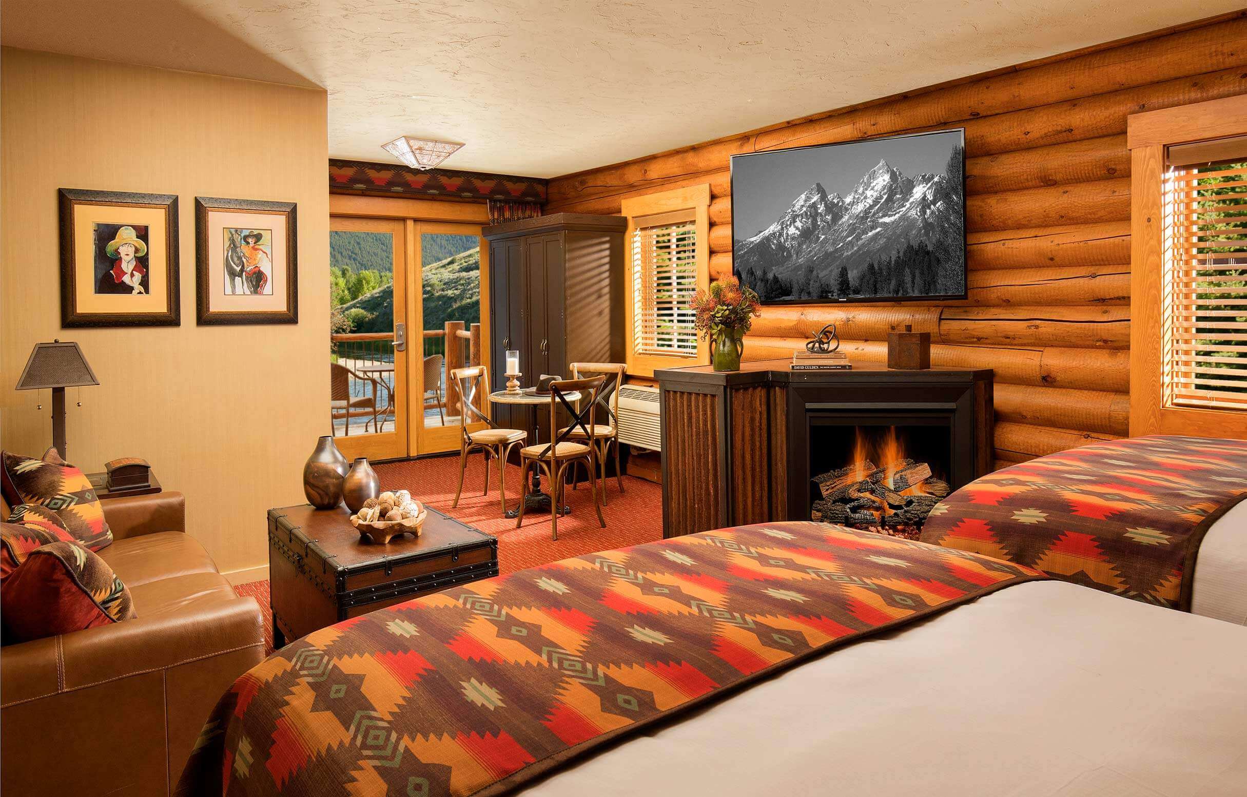 luxury hotel cabin with two queen beds and fireplace