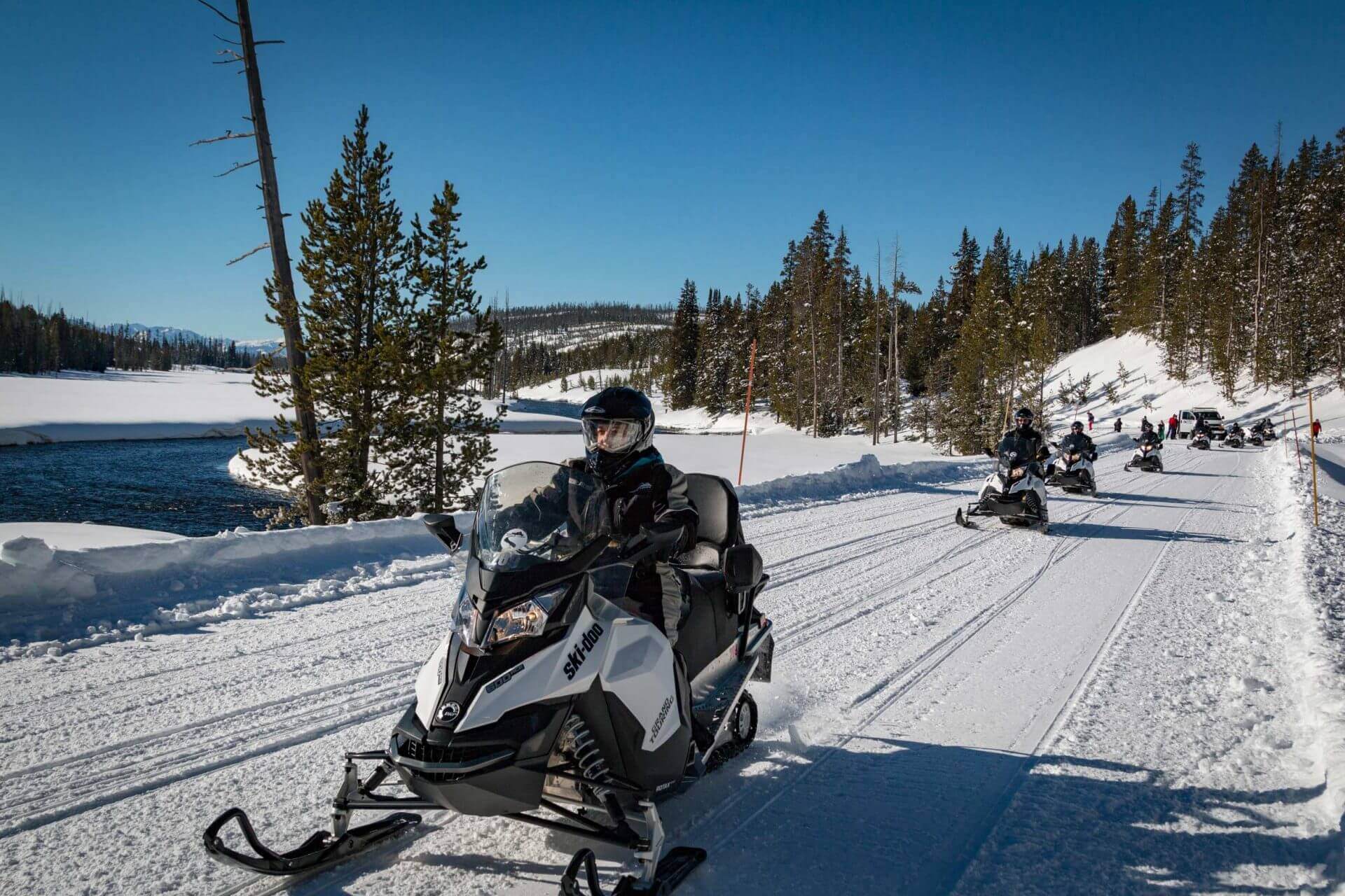 snowmobilers driving in Yellowstone