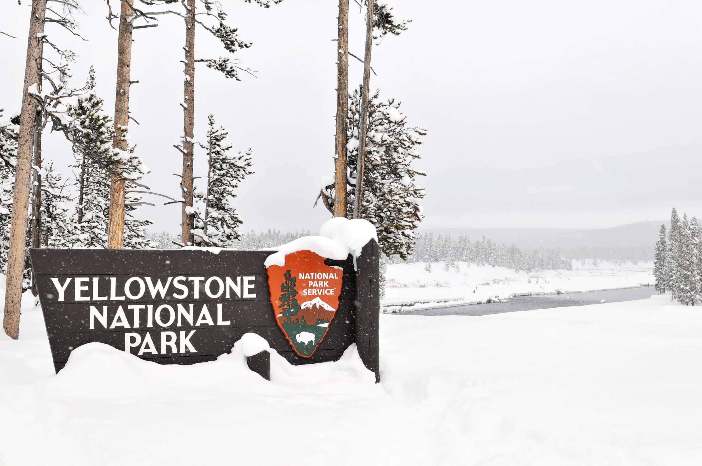 Yellowstone National Park entrance sign in winter